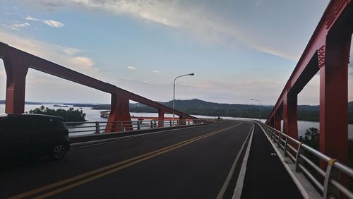 Bridge over road against sky