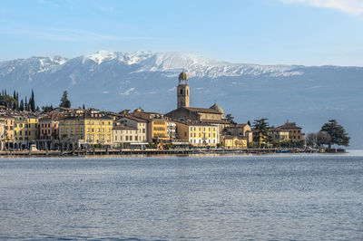 The beautiful lakeside of salò with the lake garda and the monte baldo in background