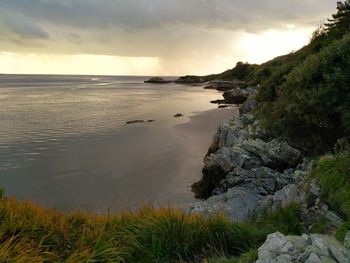 Scenic view of sea against sky at sunset