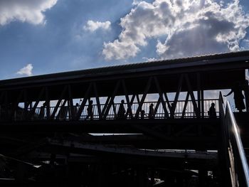 Low angle view of bridge against sky in city