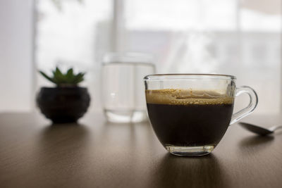 Close-up of coffee served on table