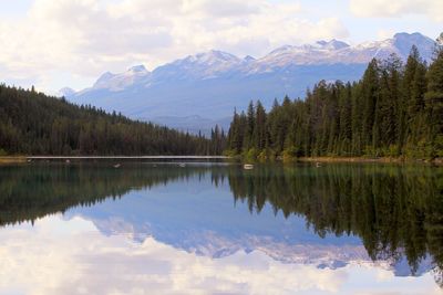 Scenic view of lake and mountains against sky