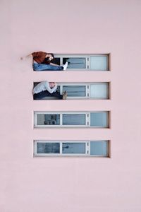 High angle view of young woman on building