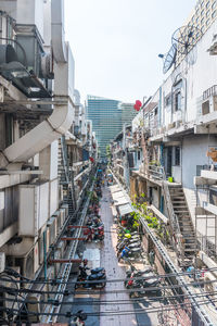 High angle view of boats in canal amidst buildings in city