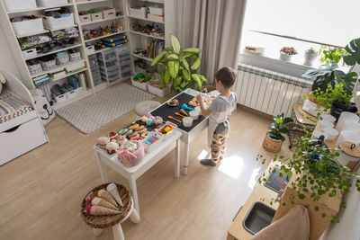 High angle view of woman sitting on table