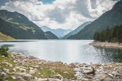 Scenic view of lake and mountains against sky