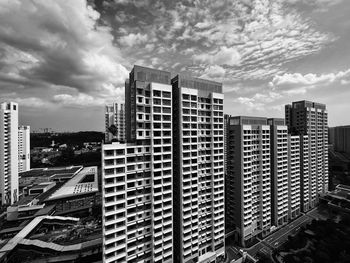 Modern buildings in city against sky