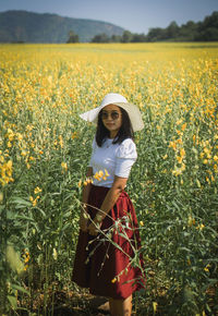 Full length of woman standing on field