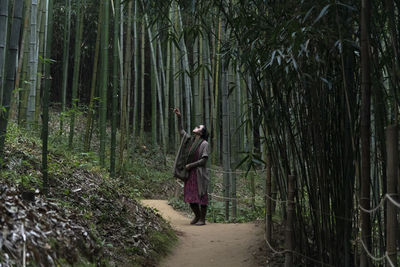 View of a woman in the bamboo forest