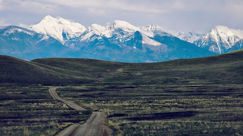 Scenic view of snowcapped mountains against sky