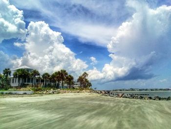 Scenic view of landscape against cloudy sky