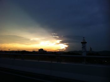 Silhouette buildings against sky during sunset