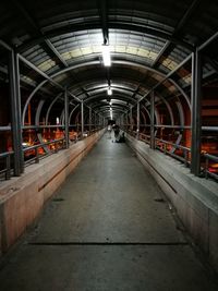 Illuminated walkway at night