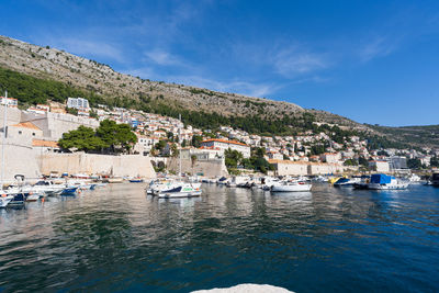 Boats in sea against sky