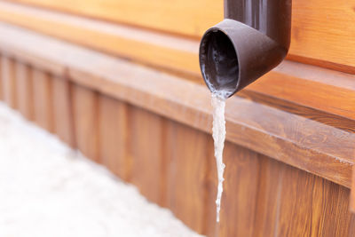 Close-up of water falling on wood