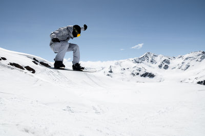Man skiing on snowcapped mountain
