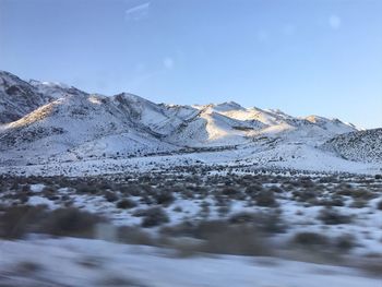 Scenic view of snowcapped mountains against sky