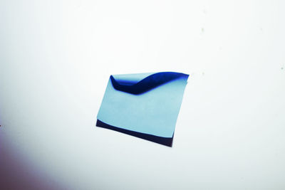 Close-up of paper over white background