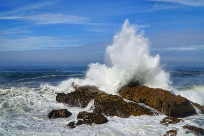 Waves breaking against sea