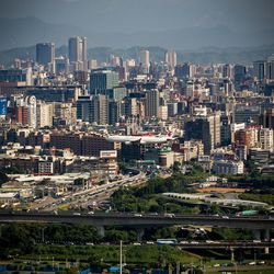 High angle view of buildings in city against sky