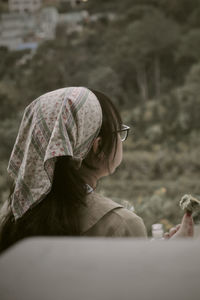 Portrait of young woman looking away