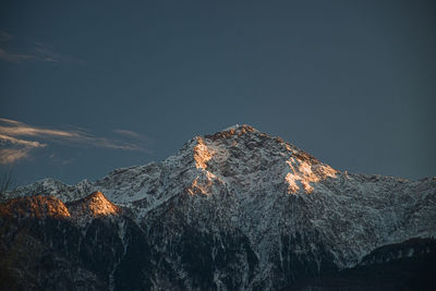 Low angle view of mountain range against clear sky