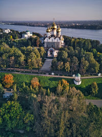 High angle view of trees and buildings against sky