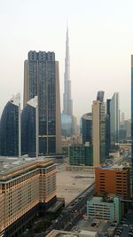 Skyscrapers in city against sky