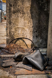 Old rusty pipe on wood against wall
