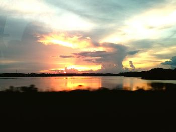 Scenic view of sunset over lake