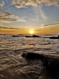 Scenic view of sea against sky during sunset