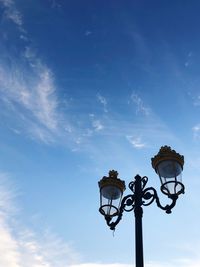 Low angle view of street light against sky