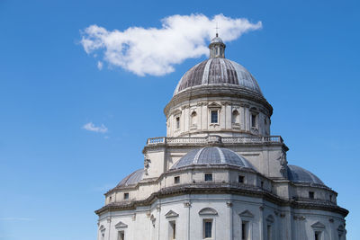 Low angle view of church against cloudy sky