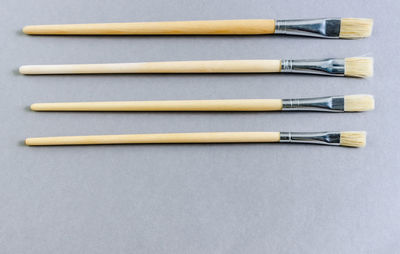 High angle view of paintbrushes on table