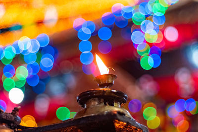 Close-up of illuminated lights against blurred background