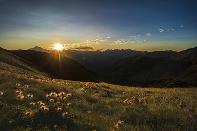 Scenic view of mountains against sky during sunset