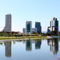 Buildings in city against clear sky