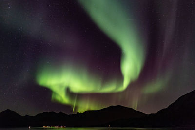 Scenic view of silhouette mountain against sky at night