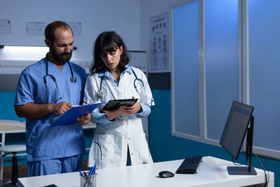 Doctor discussing with nurse in hospital