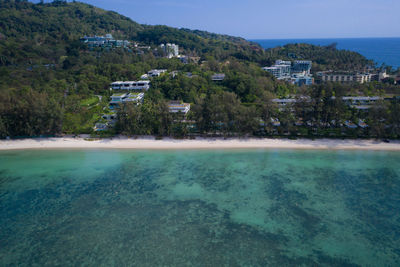 Scenic view of swimming pool by sea against sky