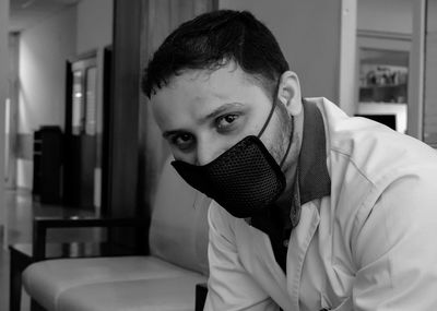 Portrait of young man at home