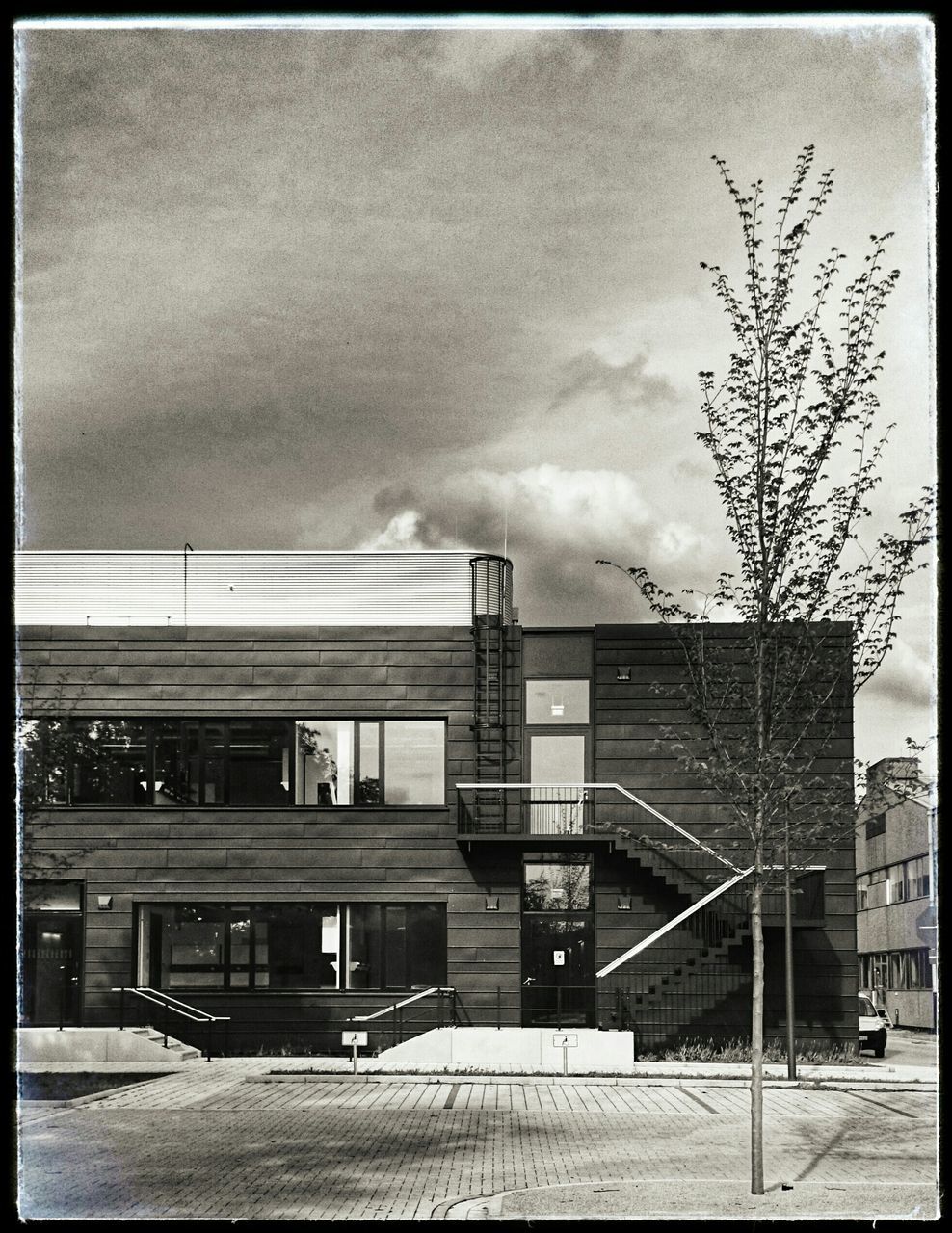 building exterior, architecture, transfer print, built structure, auto post production filter, sky, cloud - sky, city, building, residential structure, residential building, house, cloudy, day, outdoors, overcast, low angle view, street, no people, railing