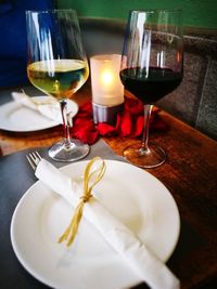 Close-up of wine glasses on table