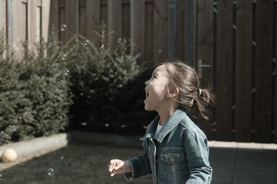 Portrait of young woman looking away