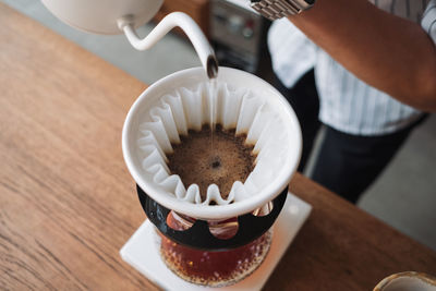 High angle view of coffee cup on table