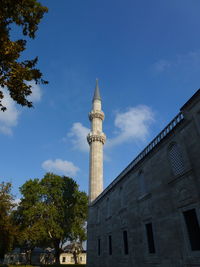 Low angle view of minarett building against sky