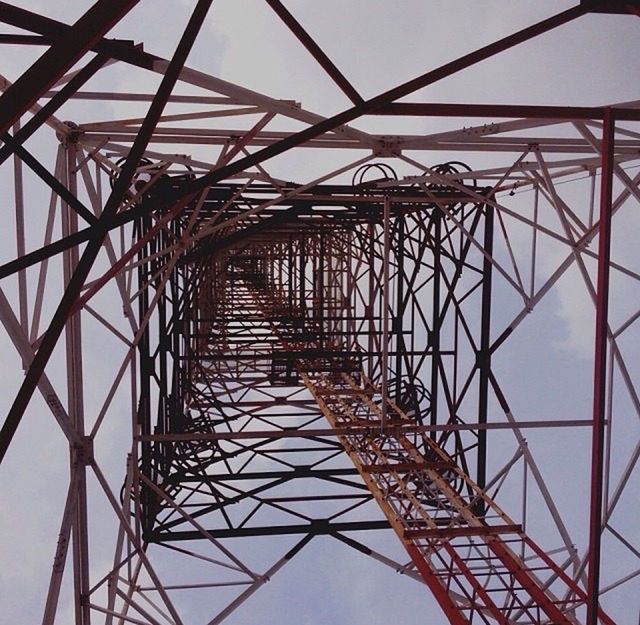 low angle view, metal, connection, metallic, electricity pylon, sky, built structure, grid, engineering, complexity, clear sky, power supply, day, power line, architecture, outdoors, no people, part of, fuel and power generation, structure