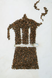 High angle view of coffee on table against white background