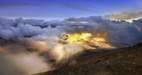 Panoramic view of volcanic landscape against sky during sunset