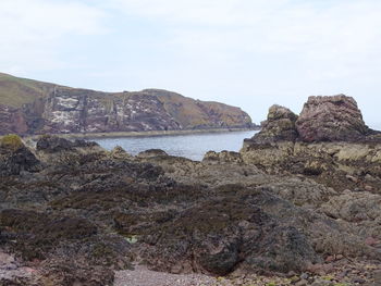 Scenic view of bay against sky